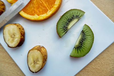 High angle view of fruits in plate on table