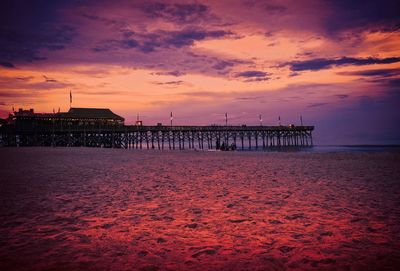 Pier on sea at dusk