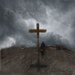 View of cross in cemetery against sky