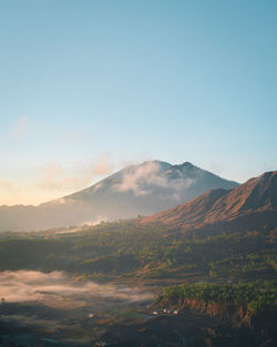 Scenic view of landscape against sky during sunset