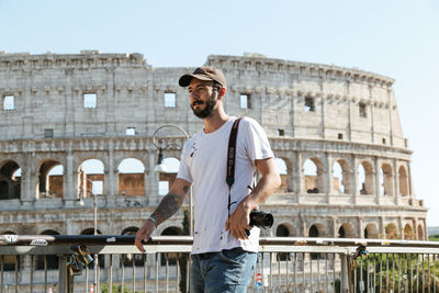 Man standing at historical building