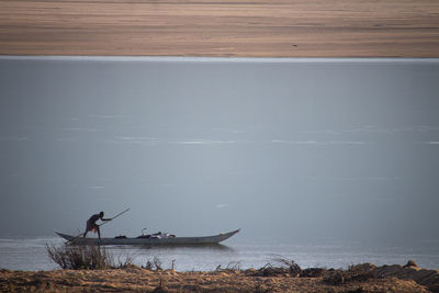 Man fishing in sea