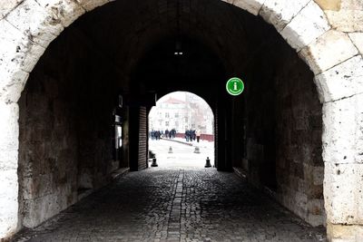 Empty alley amidst buildings in city