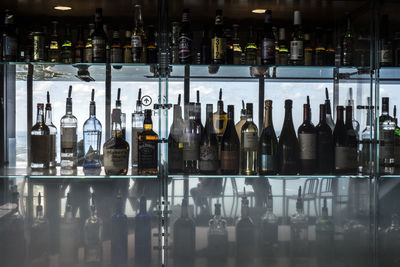 Liquor bottles in shelf