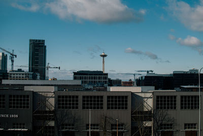 Buildings in city against sky