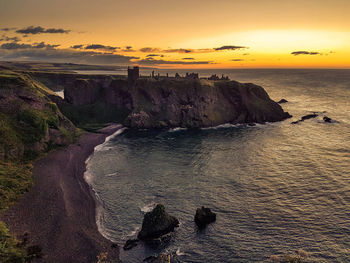 Scenic view of sea against dramatic sky