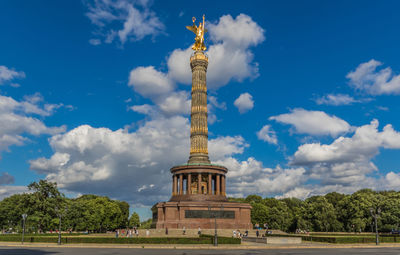 Low angle view of monument against cloudy sky