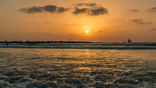 Scenic view of sea against sky during sunset