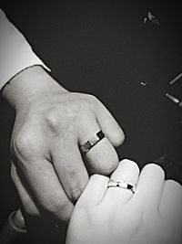 Close-up of hand holding cigarette