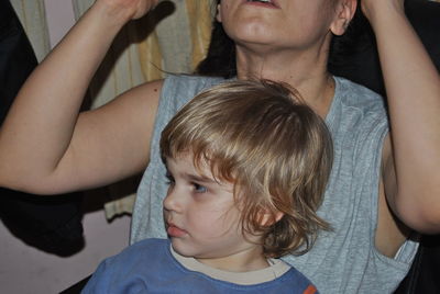Portrait of mother and daughter in hands