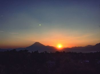 Scenic view of mountains at sunset