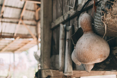 Close-up of old decoration hanging on wood