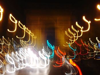 Close-up of illuminated lamp at night