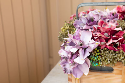 Close-up of pink flowering plant on table