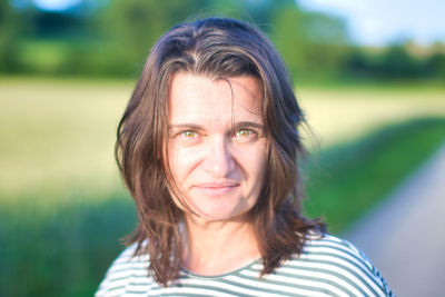 Portrait of smiling woman in park