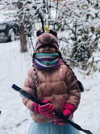 Full length of woman standing in snow