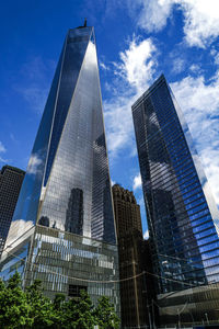 Low angle view of modern buildings against sky