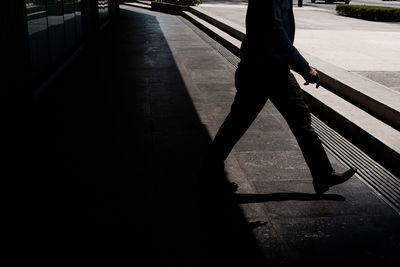 Low section of man on road