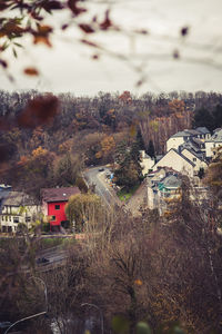 High angle view of buildings and trees against sky