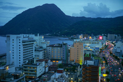 High angle view of illuminated buildings in city