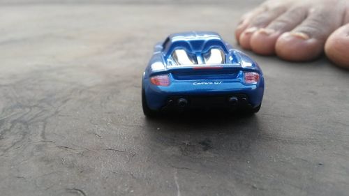 Close-up of toy car on road