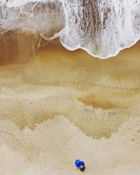 High angle view of sand on beach