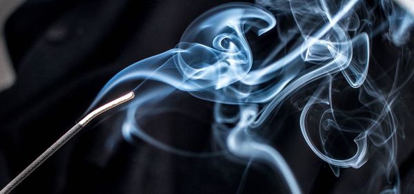 Close-up of smoke emitting from incense stick