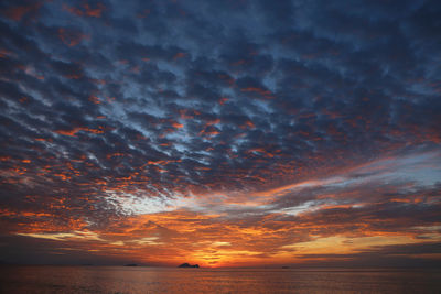 Scenic view of sea against dramatic sky