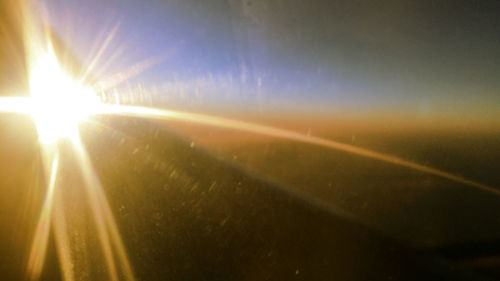 Sunlight streaming through illuminated bright sun