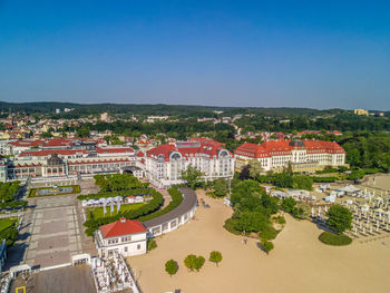 High angle view of townscape against clear blue sky