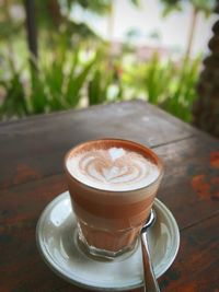 Close-up of cappuccino on table