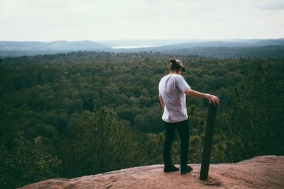 Full length of woman standing on mountain