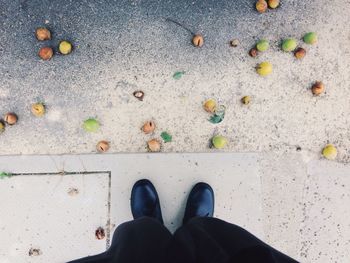 Low section of woman standing on ground