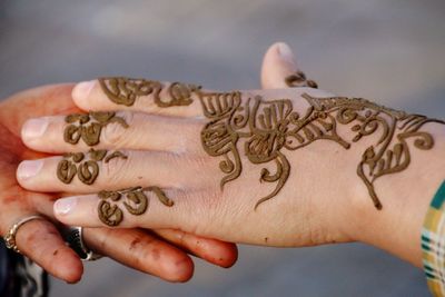 Close-up of woman hand with tattoo
