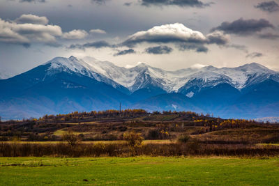 Scenic view of snowcapped mountains against sky