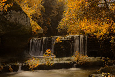 Waterfall in forest during autumn