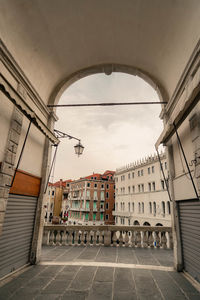 Street amidst buildings against sky