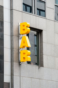 Low angle view of information sign on building