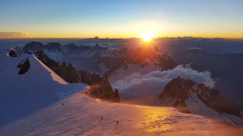 Panoramic view of mountains against sky during sunset