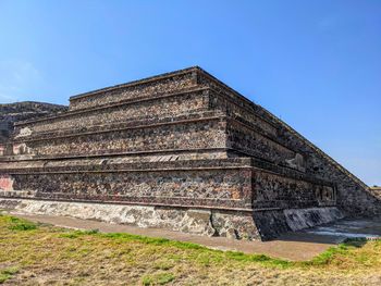 Low angle view of temple against blue sky