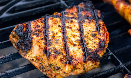 High angle view of meat on barbecue grill