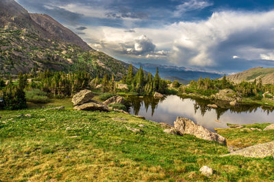 Scenic view of lake and mountains against sky