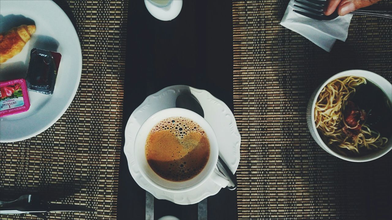 food and drink, drink, coffee cup, indoors, coffee - drink, freshness, refreshment, table, food, saucer, plate, spoon, still life, coffee, high angle view, breakfast, cup, ready-to-eat, directly above, frothy drink