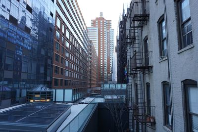 Skyscrapers in city against sky