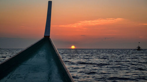 Scenic view of sea against orange sky