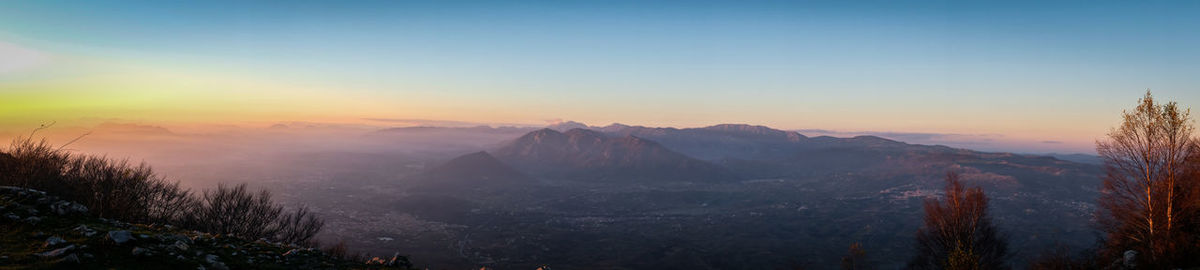 Scenic view of mountains against sky during sunset