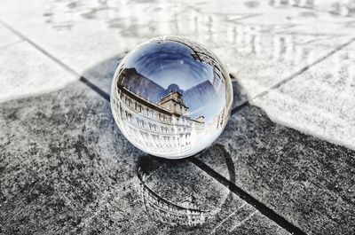 High angle view of crystal ball on glass