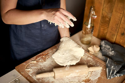 Midsection of woman preparing food