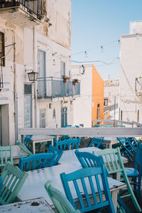 Empty chairs and tables in rows