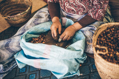 High angle view of woman working in basket